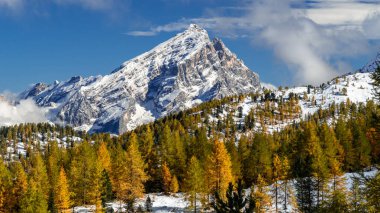 The Dolomites come alive with a golden glow, show casing natures finest palette clipart