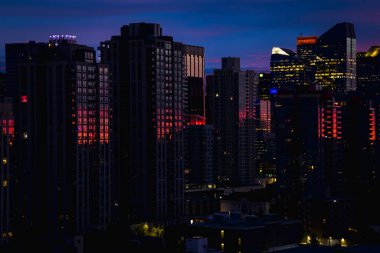 Travel destination Calgary. Panoramic view of skyline in the autumn season with bankers hall and Calgary tower clipart