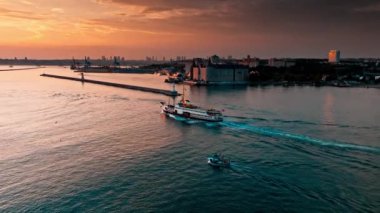 view of the sea and the ship at sunset
