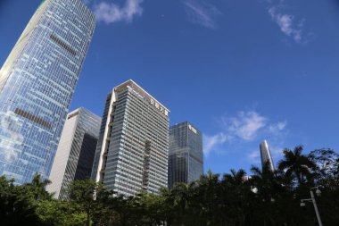 A city skyline with a large building that says 
