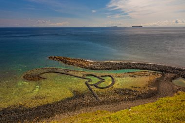 Twin Hearts Stone Weir on the Qimei island clipart