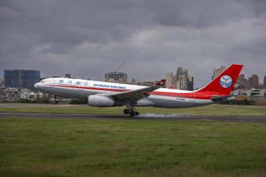 Taipei, Taiwan- 6 November 2024: Sichuan Airline landing in Taipei Songshan Airport clipart