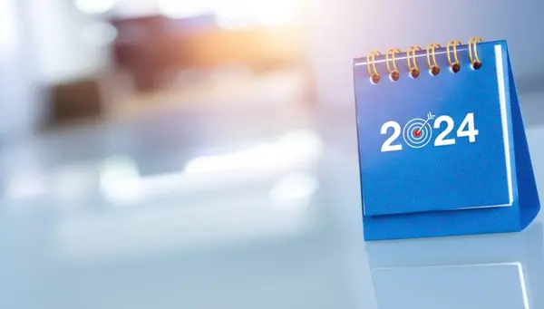 Mutlu yıllar 2024, dijital dünya haritalı 3d dünya küresi 2024 yıllık arama simgesi ve yükselen ok, mavi arkaplan üzerindeki trend büyüme grafiği ile beyaz blok yığınına yerleştirildi.