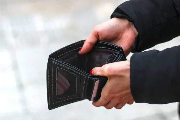 Holding empty wallet. Crisis concept