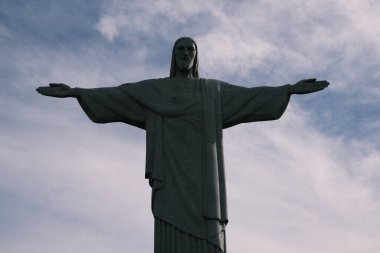The iconic Christ the Redeemer statue stands tall against the skyline of Rio de Janeiro, a symbol of peace and welcome. Its open arms embrace the city beneath, offering a protective presence and a panoramic view that captivates both locals and visito
