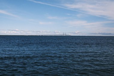 The iconic Oresund Bridge stretches majestically over the Danish waters, connecting Denmark to Sweden, a marvel of engineering and a symbol of Scandinavian connectivity and cooperation.