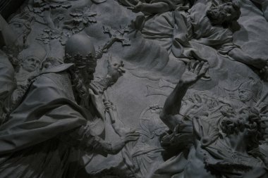 A dark and powerful religious sculpture in the Vatican City stirs the soul with its depiction of a divine narrative in marble.
