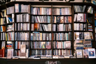 Step into a literary haven with this image of overflowing bookshelves in a cozy Jordanian bookstore. The rich collection of books, ranging from contemporary literature to historical texts, reflects the intellectual spirit and cultural depth of Jordan