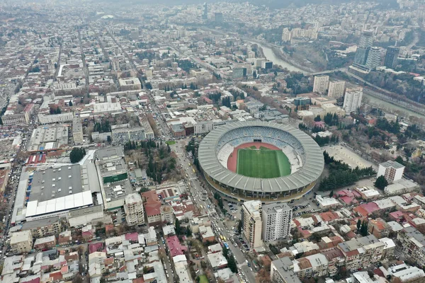 Overlooking the heart of Tbilisi, this drone-captured image showcases the city's vibrant life centered around its iconic stadium.