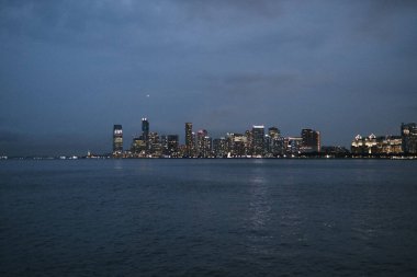 A view of a city at night from across the water
