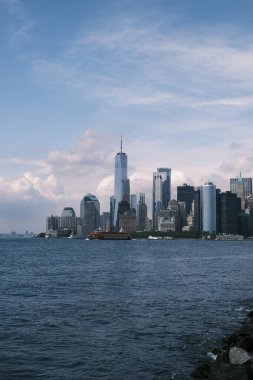 Discover a hidden gem of a vantage point where the grandeur of the Manhattan skyline unfolds before you, offering a unique and picturesque perspective that captures the essence of the city. Ideal for travel guides and urban exploration features.
