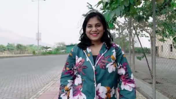 Smiling Woman Floral Dress Walking Urban Street Mountains Background Slow — Stock Video
