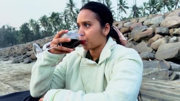 Beautiful Women Holding Wine Glass Sitting Drinking Wine Thinking Beach — Stock Video