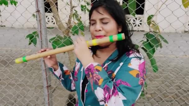 Woman Playing Traditional Bamboo Flute Outdoors — Stock Video