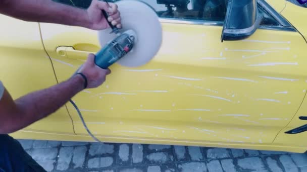 Close Person Polishing Yellow Car Electric Buffer Detailing Vehicle Exterior — Stock Video