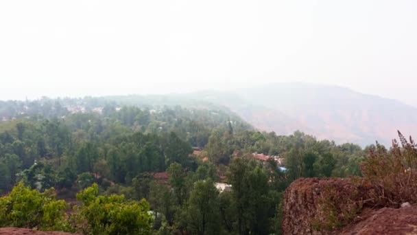 Lush Green Foliage Foreground Hazy Panoramic View Valley Hills Background — Stock Video