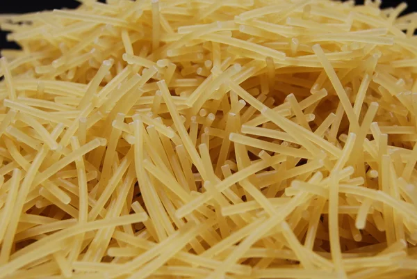 Background image of pasta.Small pasta, vermicelli. A good background for a culinary theme.