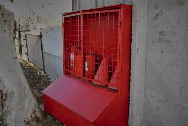 Red fire stand.Fire box with sand and fire extinguishing agents.