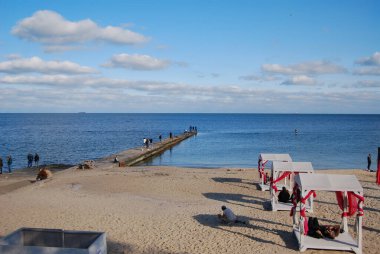 Odessa beaches on a sunny autumn day.Sunny day, lots of people relaxing. The last warm days. clipart