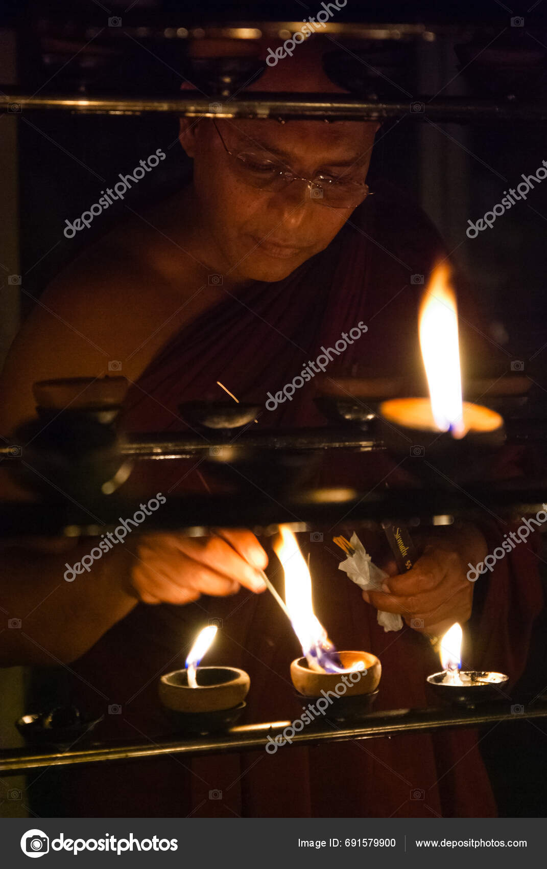 Buddhist Monk Lighting Traditional Oil Lamps Stock Editorial Photo