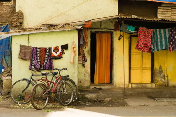 stock image Bicycles parked in front of a poor house