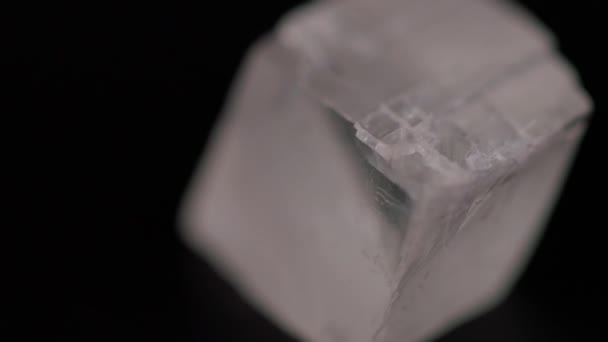 Close Iceland Spar Calcite Mineral Stone Texture Rotating Black Background — Stock Video
