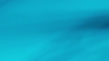 Arkaplanda dönen cam nesnelerin soyut ışık yansıması.