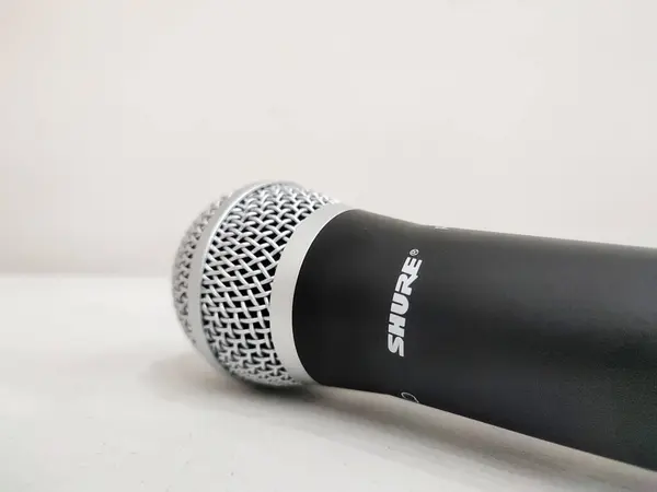 stock image Shure wireless microphone isolated on a white background, Surakarta, Indonesia - December 9, 2023