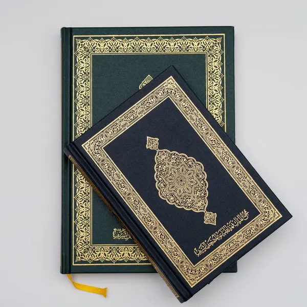 Medium and small size holy quran books isolated on a white background. top view. a set of holy quran.