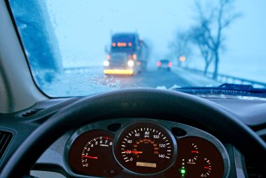 Dangerous Driving in winter. clipart