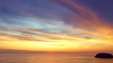 Colorful sky at sunset. Gradient color. abstract nature background.Sunset with strong color clouds light rays and other atmospheric effects.aerial view stunning red sky sunset at Kata beach Phuket.