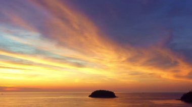 Colorful sky at sunset. Gradient color. abstract nature background.Sunset with strong color clouds light rays and other atmospheric effects.aerial view stunning red sky sunset at Kata beach Phuket.