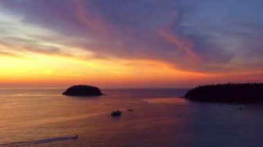 Colorful sky at sunset. Gradient color. abstract nature background.Sunset with strong color clouds light rays and other atmospheric effects.aerial view stunning red sky sunset at Kata beach Phuket.