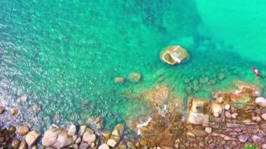 Colorful turquoise sea. Gradient color. sea texture, abstract nature background. aerial top view smooth waves in Phuket sea hit on the rocks. color sea light rays and other atmospheric effects.