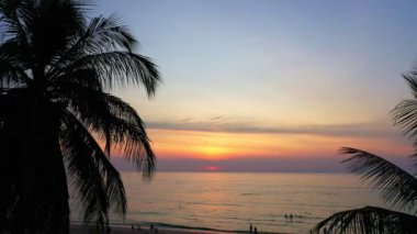 aerial view beautiful sunset above the ocean in coconuts channel at Karon beach.scenery sunlight on the horizon.Scene of colorful light in the sky background.sea sports environment background.