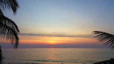 aerial view beautiful sunset above the ocean in coconuts channel at Karon beach.scenery sunlight on the horizon.Scene of colorful light in the sky background.sea sports environment background.