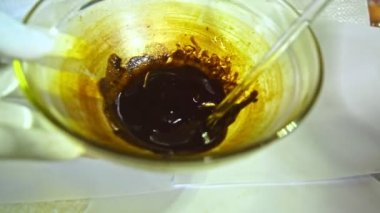 .Using heat to simmer cannabis buds to stimulate cannabinoids. Use a glass rod to stir the cannabis oil..Hemp oil color is dark brown and sticky..hemp oil extraction. Herbs with great benefits