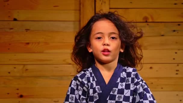 Cute Little Boy Sits Wooden Room Swaying His Hair Slow — Wideo stockowe