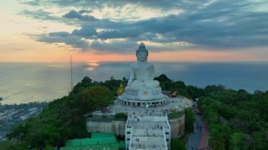 aerial view beautiful sunrise at Phuket big Buddha on the hilltop. Phuket white big Buddha is the famous landmark in Phuket.Aerial panoramic view landscape Phuket big Buddha.