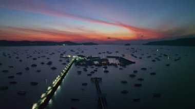 aerial view Chalong gulf in colorful of twilight. first light above archipelago in chalong gulf Phuket thailand.4k stock footage video in travel concept.