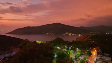 aerial photography colorful sky in twilight above Promthep cape viewpoint . Promthep cape is the most popular and famous viewpoint in Phuket island. Scene of Colorful light in the sky background.