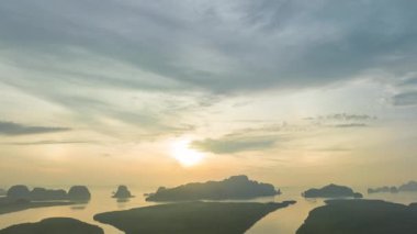 aerial Hyper lapse view over the island.View of the sunrise over a group of islands in Phang Nga Bay.Ban Sam Chong Fishing Village in Phang Nga.4k video islands background.