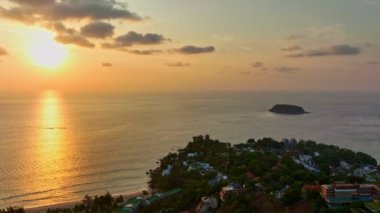 aerial panorama view beautiful sky over the sea at three beaches viewpoint..popular landmark to see three beaches..Kata Noi beach, Kata beach and Karon beach..golden sunset background.aerial panorama 