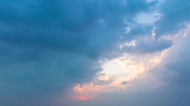 aerial hyper lapse view Clouds cover the sky..The sun shines through the clouds in the evening..white cloud in blue sky background..4K video for Nature and travel concept.