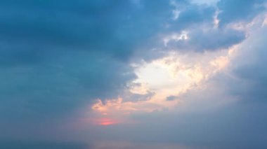 aerial hyper lapse view Clouds cover the sky..The sun shines through the clouds in the evening..white cloud in blue sky background..4K video for Nature and travel concept.