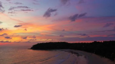 aerial view colorful sky in twilight at Kata beach Phuket..abstract nature background. .Sunset with sweet color light rays and other atmospheric effects over the island..4k video