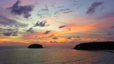 aerial view colorful sky in twilight at Kata beach Phuket..abstract nature background. .Sunset with sweet color light rays and other atmospheric effects over the island..4k video