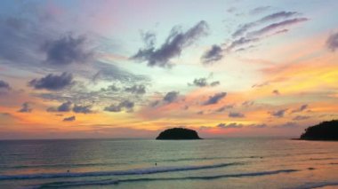 aerial view colorful sky in twilight at Kata beach Phuket..abstract nature background. .Sunset with sweet color light rays and other atmospheric effects over the island..4k video