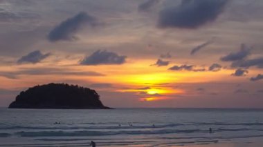 time mlapse colorful sky in twilight at Kata beach Phuket..abstract nature background. .Sunset with sweet color light rays and other atmospheric effects over the island..4k video 