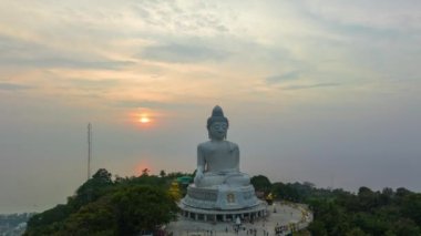 aerial Hyperlapse view around Phuket big Buddha in beautiful sunset.360 degree view on Phuket big Buddha viewpoint.Video clips for travel and religious ideas.smooth sea and sky background.